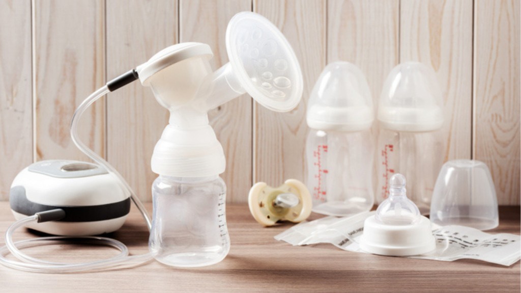 Electric breast pump with bottles and storage bags